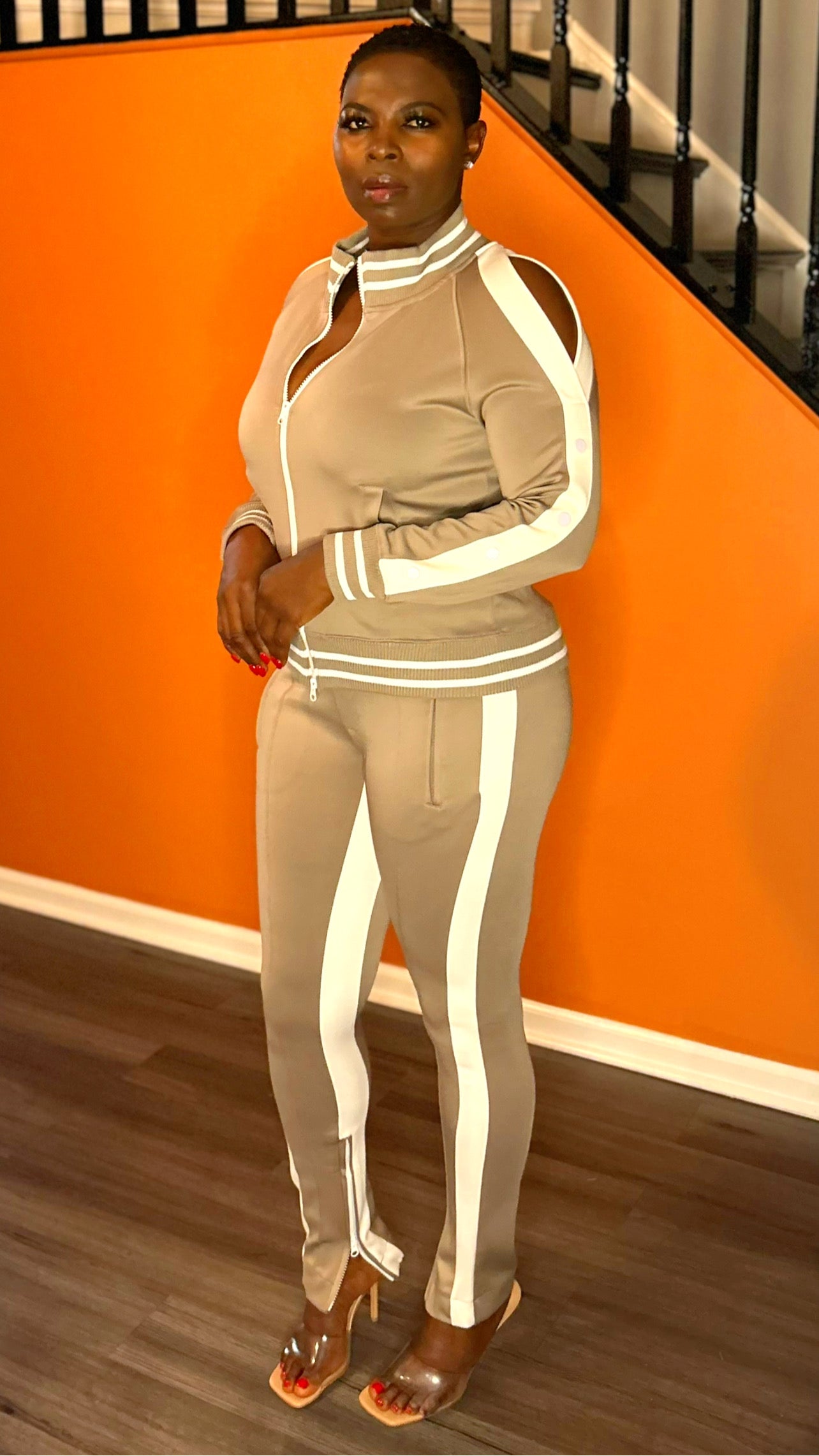 Side profile of the natural 2-piece tracksuit women's set, highlighting its relaxed fit and soft color.