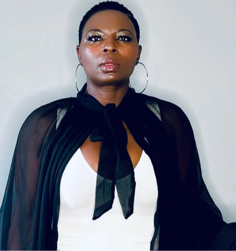 Close-up of the sheer fabric and cuff detailing on the black balloon sleeve blouse.