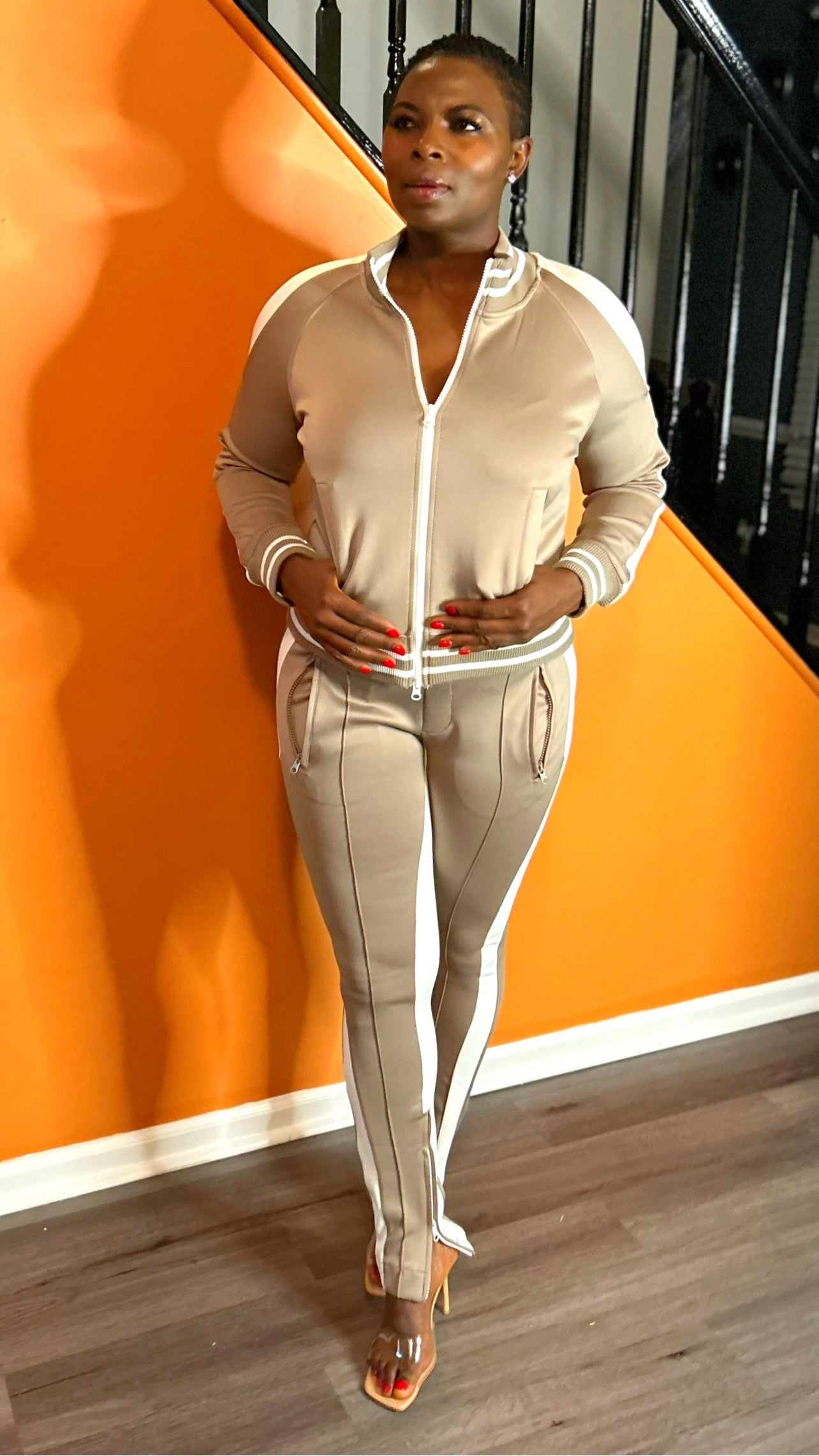 Close-up of the cold-shoulder top design, adding a modern twist to the natural tracksuit.