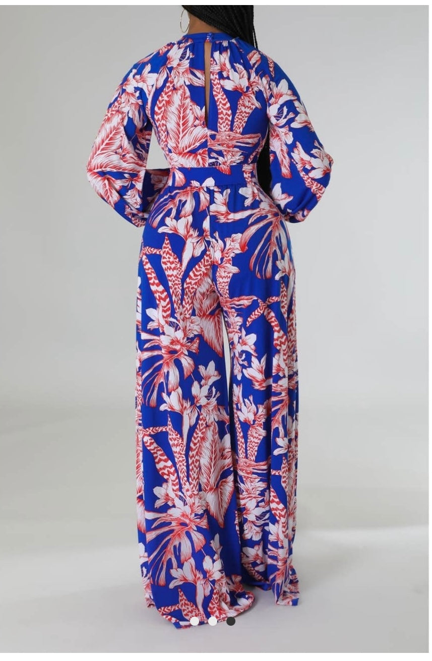 Back profile of the floral jumpsuit showing the elegant wide-leg fit.