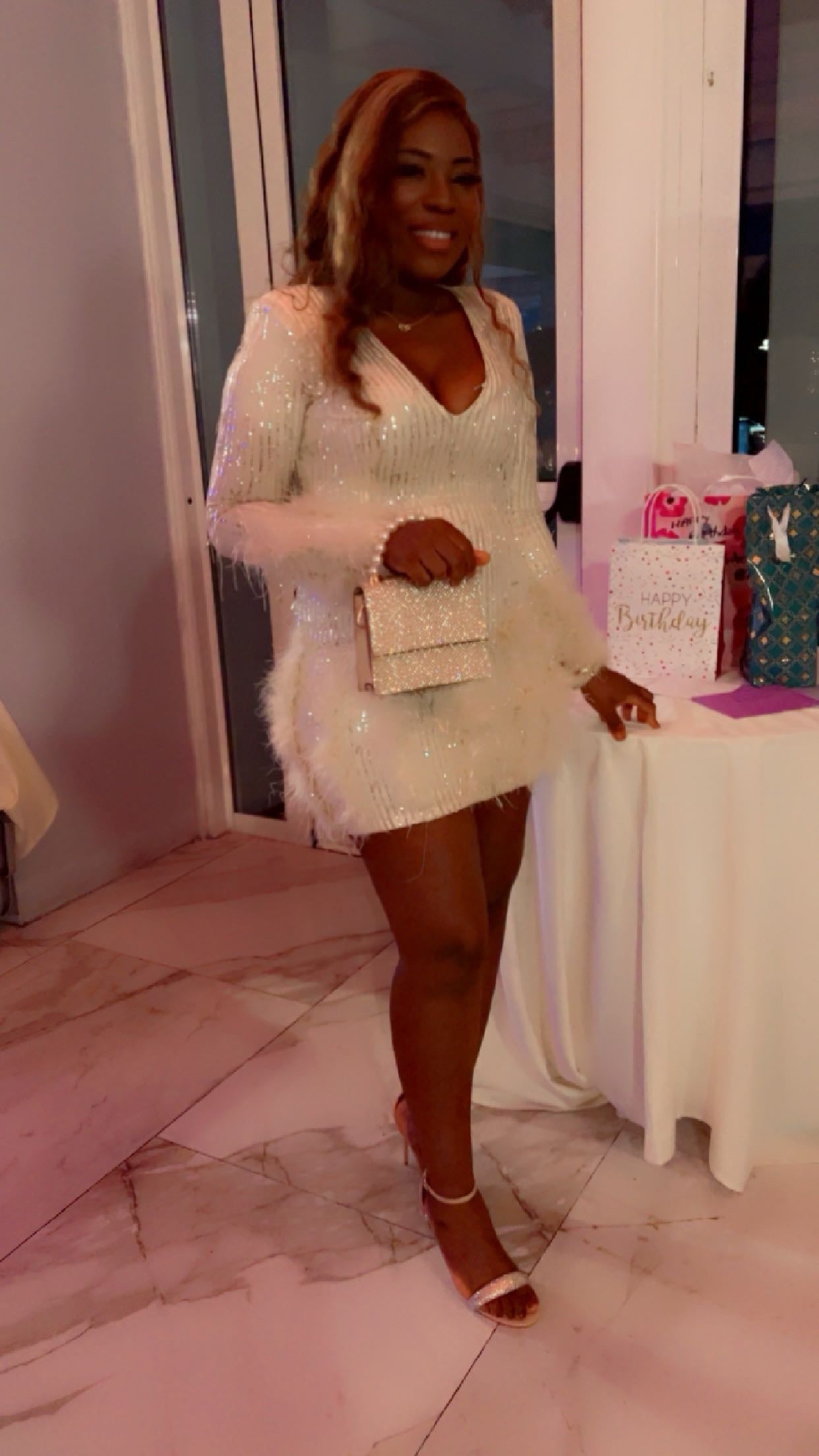 White cocktail dress styled with heels, perfect for weddings and formal gatherings