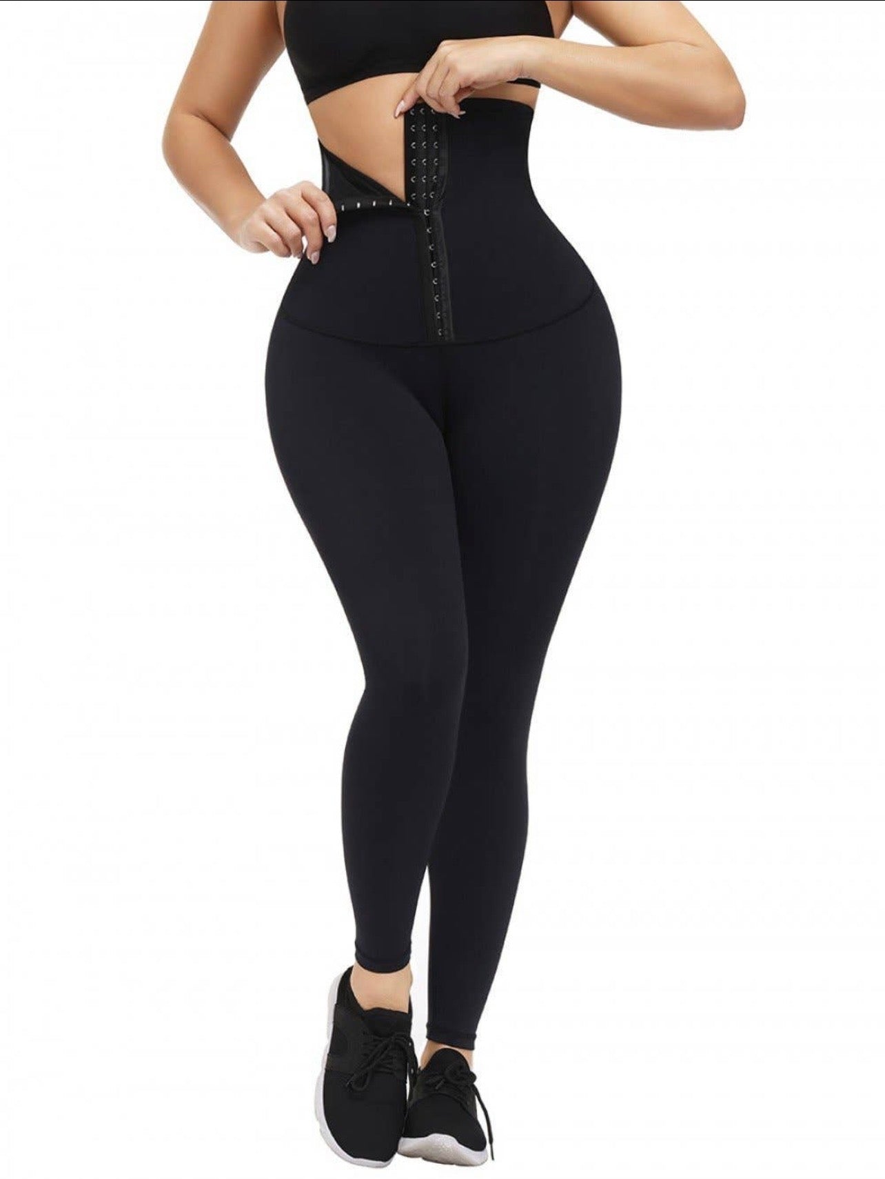 "Close-up of the corset-style waistband on the waist trainer leggings for firm tummy support