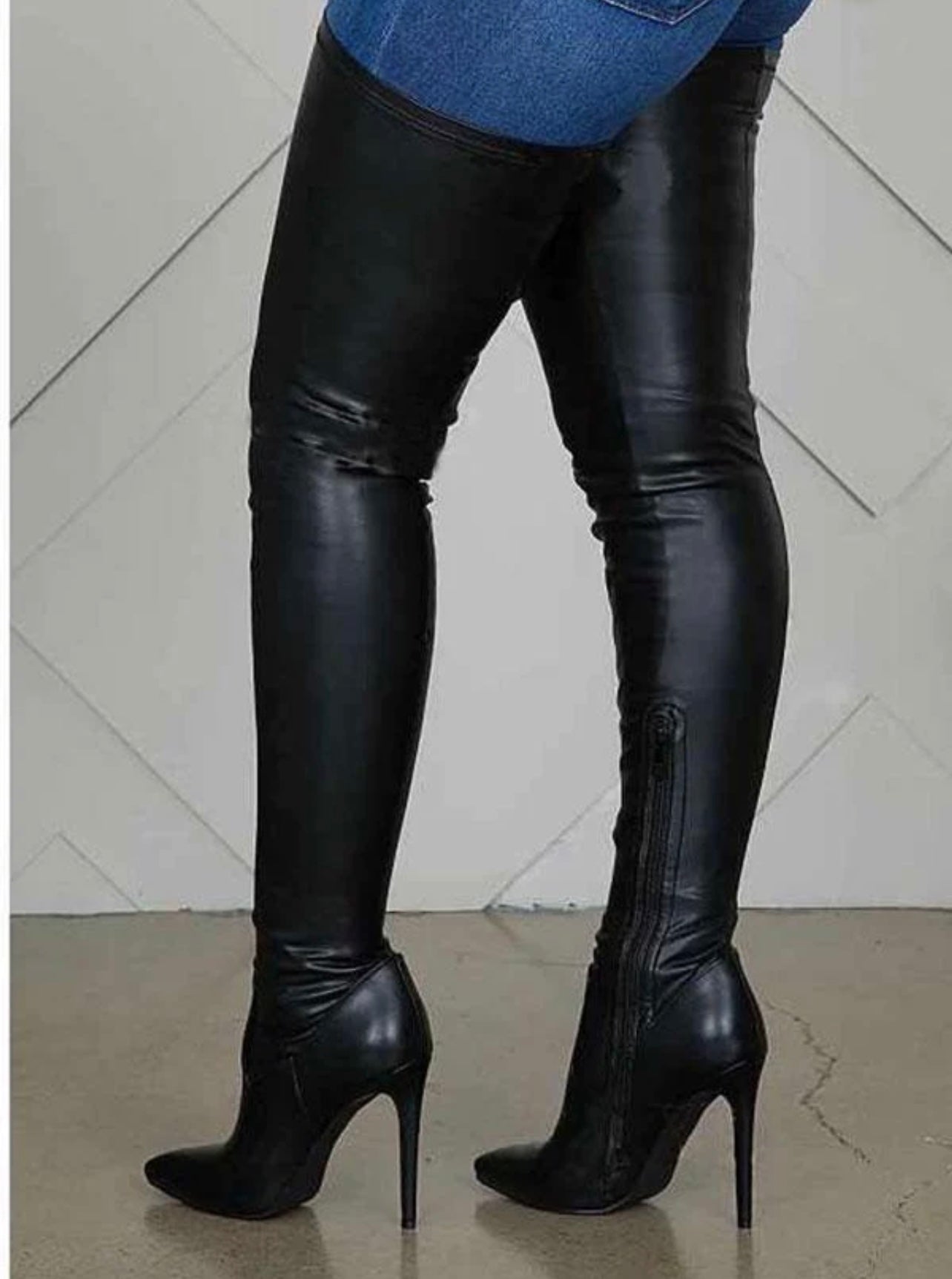 Side profile of flat black over the knee boots, perfect for casual and chic outfits