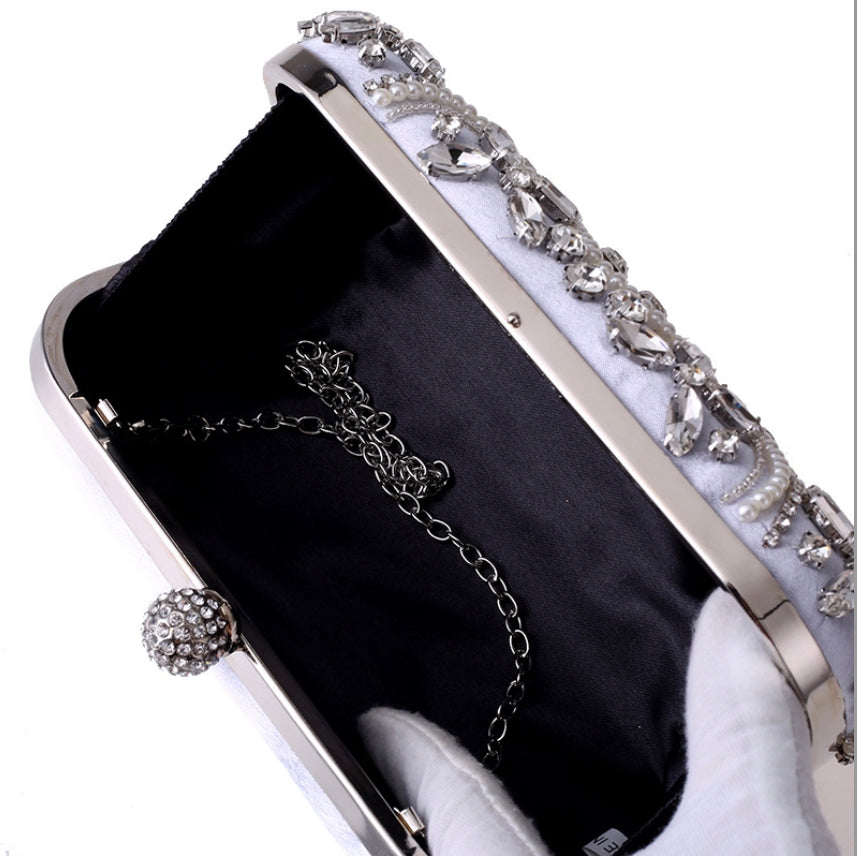 Interior of the small evening bag with ample space for essentials like a phone and lipstick.