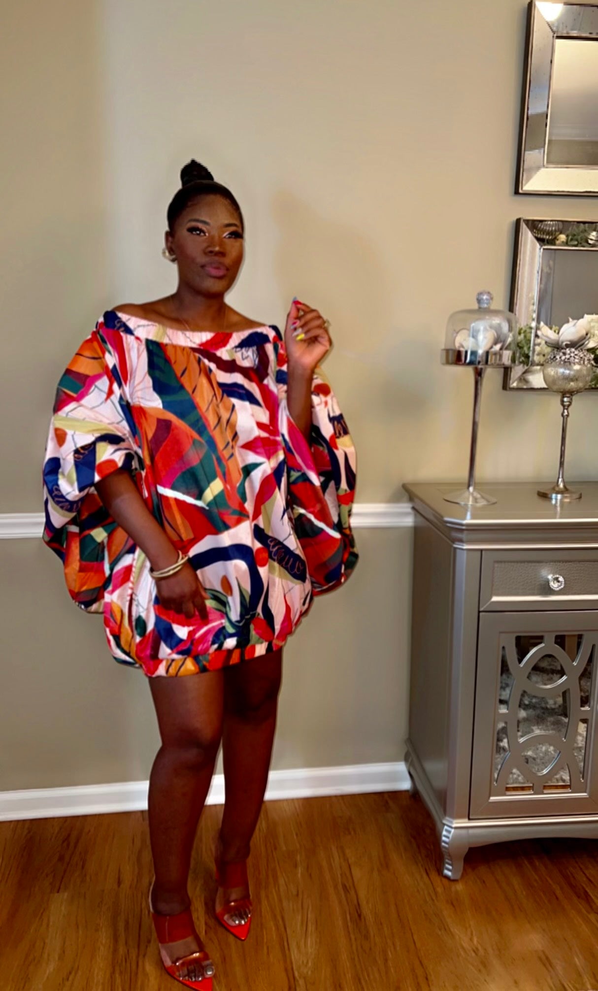 Model wearing a Floral mini shirt dress with an off-the-shoulder design, perfect for casual and chic occasions.