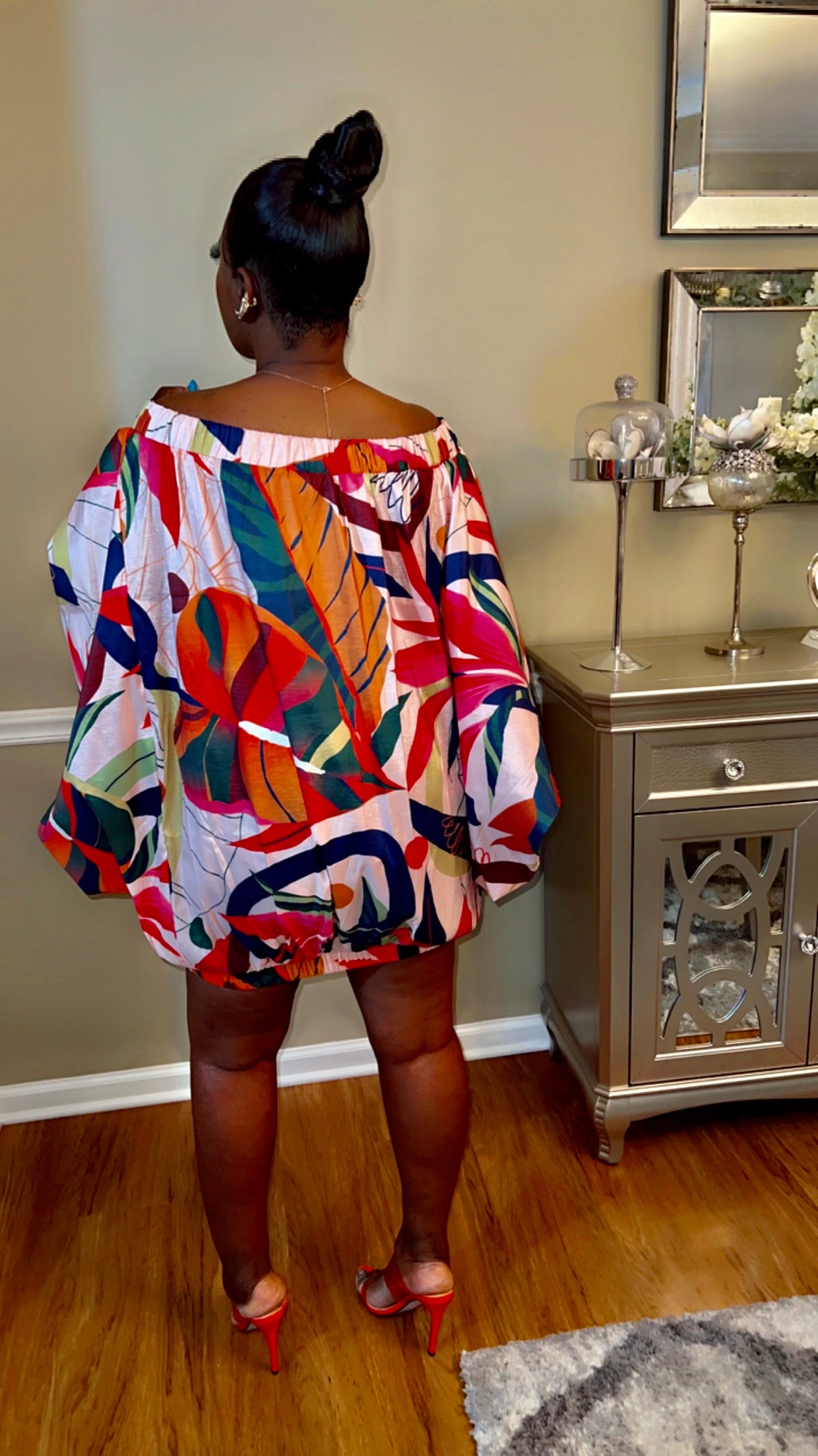 Back View of the 2-in-1 shirt dress highlighting its playful mini length and relaxed fit."