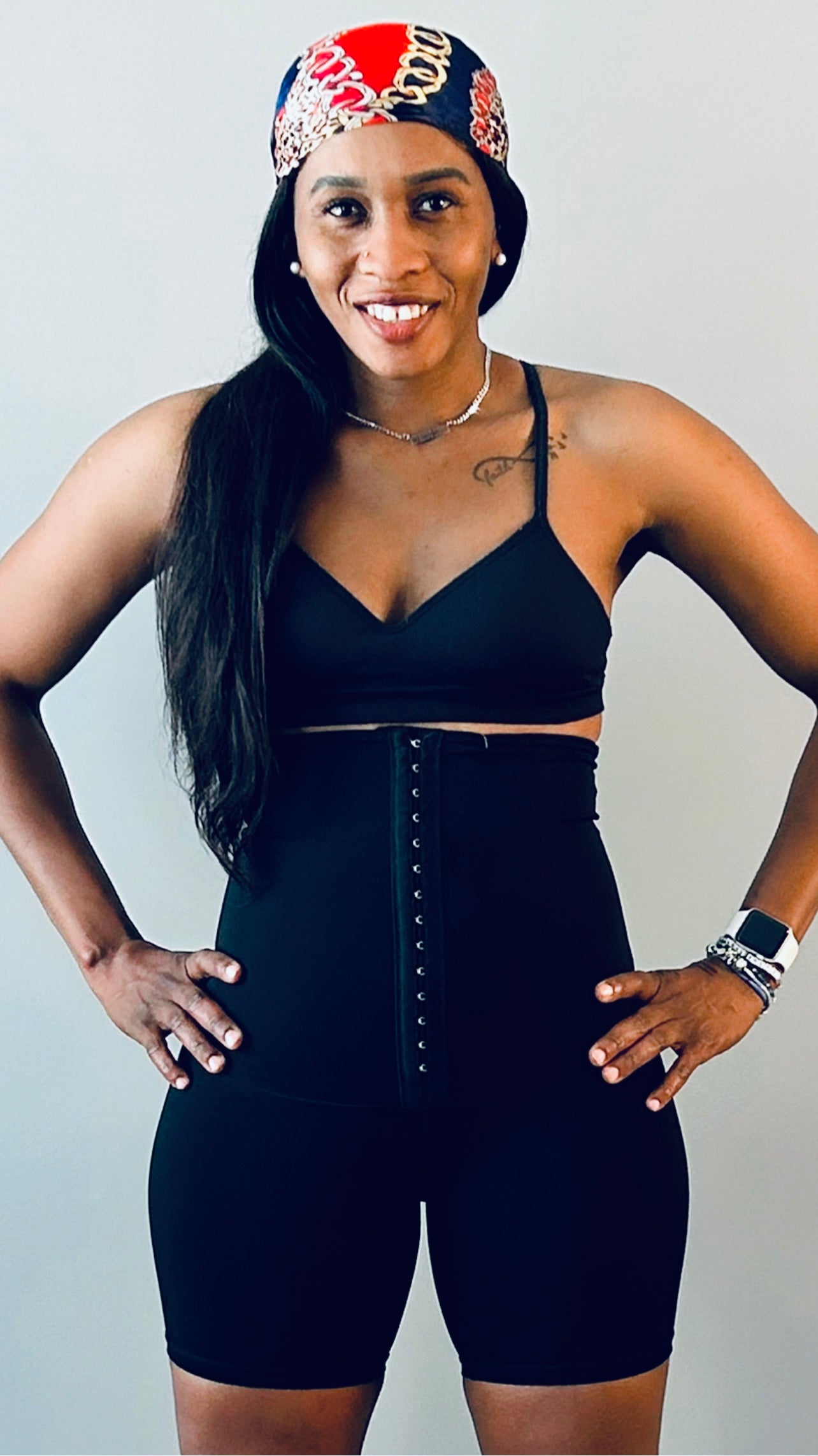 Model wearing waist trainer shorts with a corset-style design for targeted tummy control