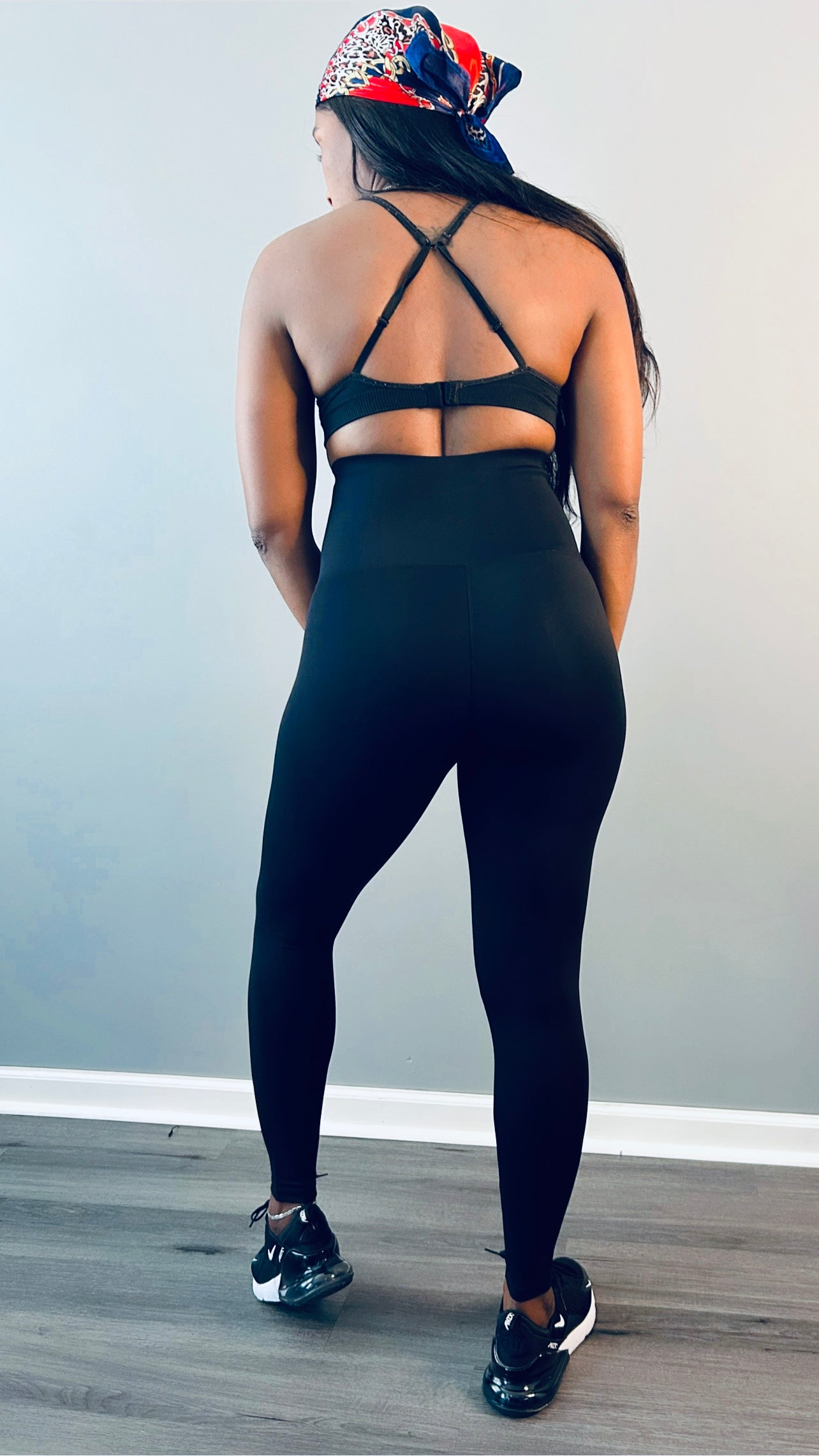 Back view of the black waist trainer leggings showing the high-waist fit and sleek silhouette.
