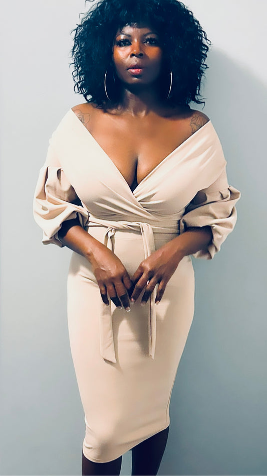 Front profile of the nude midi dress showcasing its body-hugging fit and belted waist."